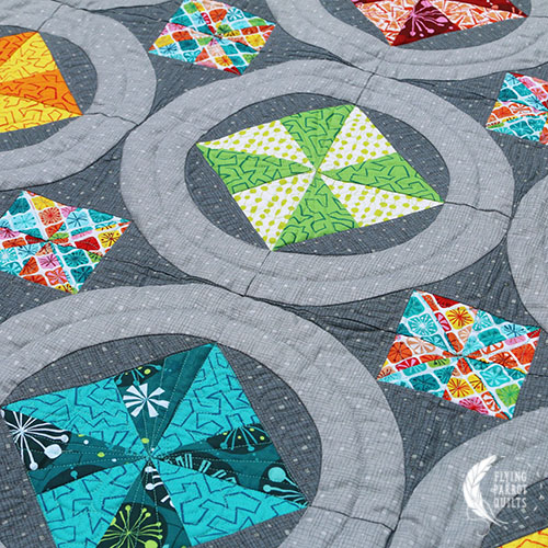 Pinwheel Rings quilt by Sylvia Schaefer/Flying Parrot Quilts | www.flyingparrotquilts.com