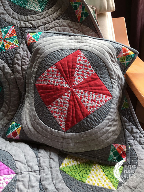 Pinwheel Rings pillow. Pattern by Sylvia Schaefer/Flying Parrot Quilts | www.flyingparrotquilts.com