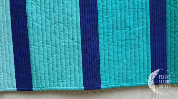 detail of binding on Cool Pool by Sylvia Schaefer/Flying Parrot Quilts | www.flyingparrotquilts.com