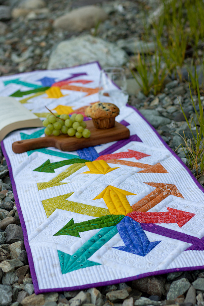 Rainbow Arrows table runner by Sylvia Schaefer/Flying Parrot Quilts | www.flyingparrotquilts.com