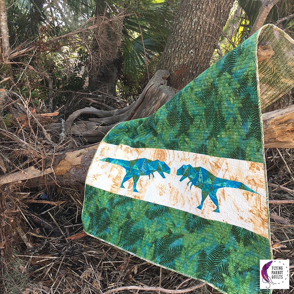 Geo Rex dinosaur baby quilt by Sylvia Schaefer | Flying Parrot Quilts | www.flyingparrotquilts.com