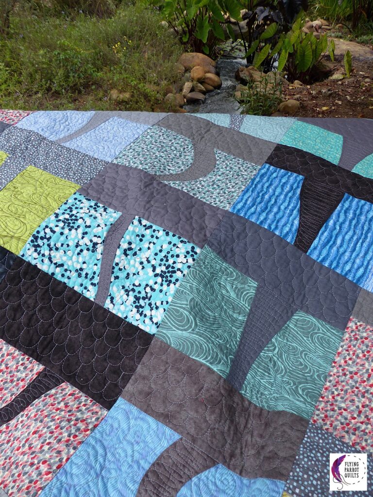 Twister improv pieced quilt pattern by Sylvia Schaefer/Flying Parrot Quilts | www.flyingparrotquilts.com